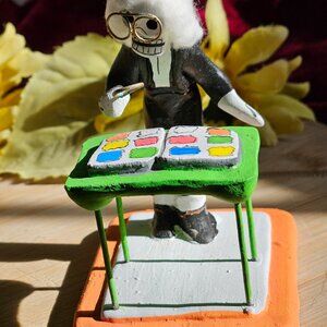 VINTAGE OAXACAN TEACHER INSPECTS COLORFUL PICTURES SCULPTURE